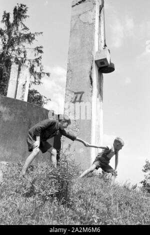 Ein mit Gas Haushalt befeuerter, Deutsches Reich 1930er Jahre. A gas per uso domestico illuminato, Germania 1930s. Foto Stock