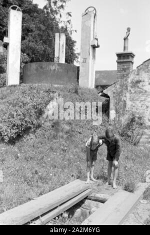 Ein mit Gas Haushalt befeuerter, Deutsches Reich 1930er Jahre. A gas per uso domestico illuminato, Germania 1930s. Foto Stock