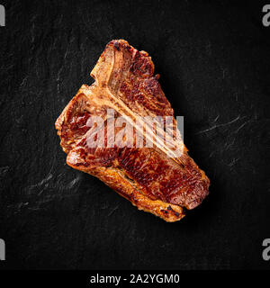 Piatto di laici grigliate di T-bone steak sul tavolo di pietra Foto Stock