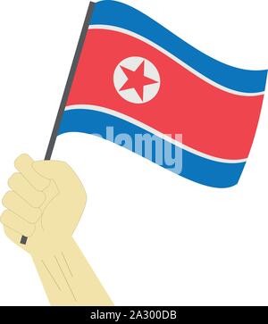 Mano azienda e innalzare la bandiera nazionale della Corea del Nord Illustrazione Vettoriale