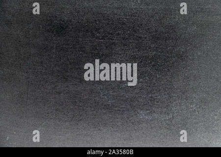 Grunge di colore bianco gesso texture nera su sfondo della scheda Foto Stock