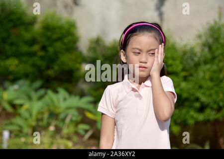 Stanco di una giovane donna asiatica Foto Stock