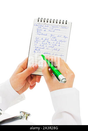 Giovani dolce medico scrive qualcosa Foto Stock