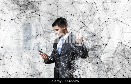Persona di Business puntando sulla rete astratta Foto Stock