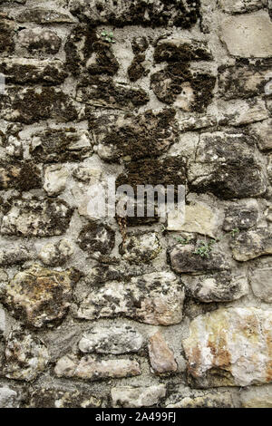 Muro di pietra in strada urbana, di costruzione e di architettura, textures Foto Stock