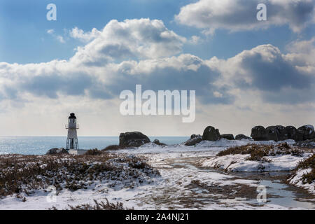 Peninnis Capo Faro, St. Mary's, isole Scilly, UK, sotto una rara caduta di neve Foto Stock