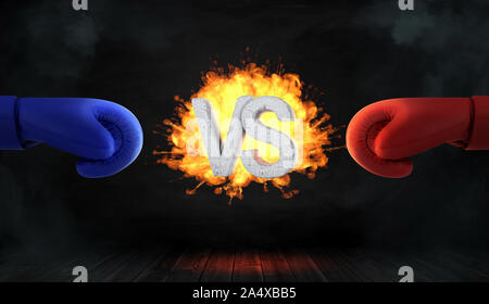 3D rendering di incandescente blast con calcestruzzo lettere VS sta tra un punto rosso e uno blu guanto boxe. Foto Stock