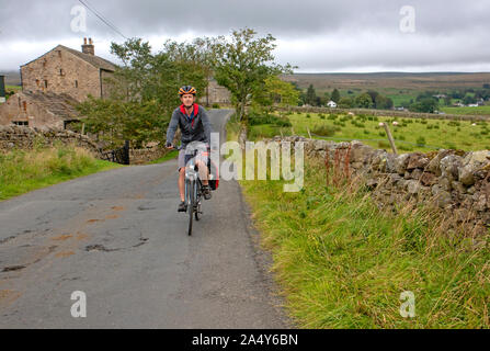 Escursioni in bicicletta attraverso Alston Moor, parte del Coast to Coast in bicicletta Foto Stock