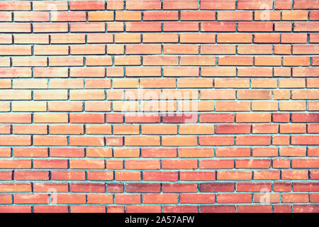 Un muro di mattoni. Sfondo. Casa di mattoni mattoni color arancione Foto Stock