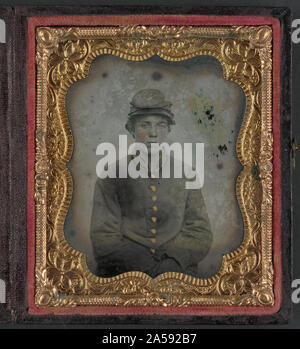 Unidentified giovane soldato confederato in uniforme e cappello con insegne di artiglieria Foto Stock