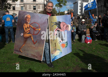 Kaya Mar artista turco fumettista politico con i suoi dipinti di Jeremy Corbyn e Boris Johnson. 2019 Londra Regno Unito. Raduno in Piazza del Parlamento per la campagna di voto dei popoli. 2010S UK HOMER SYKES Foto Stock