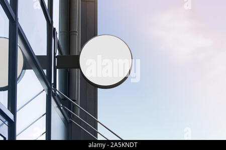 Bianco bianco esterno scatola rotonda mockup su un edificio di vetro Foto Stock