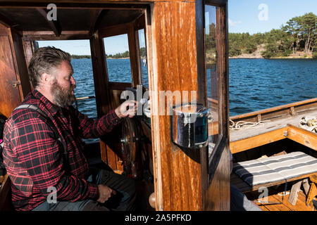 Uomo sulla barca Foto Stock