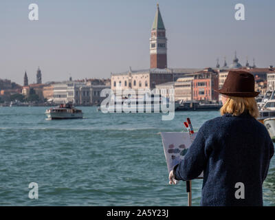 L'Italia, Veneto, Venezia, pittore dipinge il palazzo ducale su una tela di canapa Foto Stock