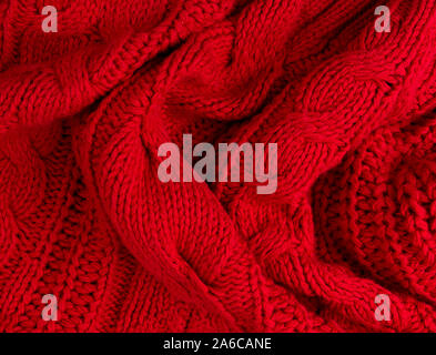 La texture di rosso di tessuto a maglia stretta verso l'alto. Maglia di lana Foto Stock