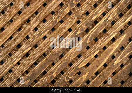 La consistenza del reticolo in legno. In legno naturale reticolo diagonale. Close-up. Vista superiore Foto Stock