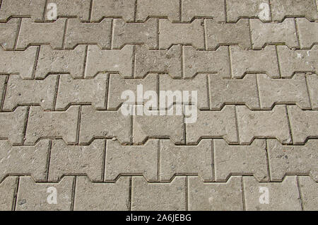 Calcestruzzo o ciottoli grigio marciapiede in lastre o pietre per pavimenti Foto Stock