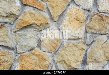 Muro di pietra texture. In ciottoli naturali parete come sfondo. Foto Stock