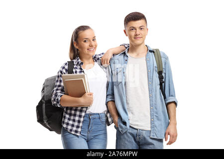 Due studenti con libri e zaini isolati su sfondo bianco Foto Stock