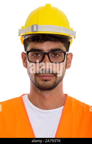 Volto del giovane uomo persiano lavoratore edile indossando occhiali da vista Foto Stock