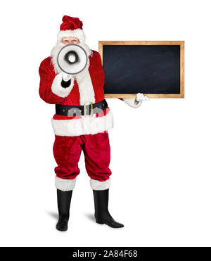 Classico rosso tradizionale santa claus rende annuncio con megafono bullhorn holding vuoto di legno lavagna ardesia chalkboark. vuoto ardesia con copia Foto Stock