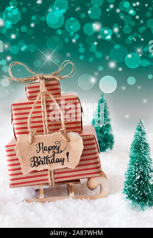 Sled, presente, neve Happy Birthday, sfondo verde Foto Stock