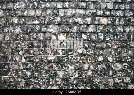 Muro di pietra focaia texture. Full-frame shot di tessitura tradizionale di un muro di pietra focaia come comunemente trovati in tutta l'Europa. Foto Stock