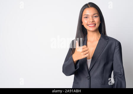 Ritratto di felice giovane bella asiatica imprenditrice dando pollice in alto Foto Stock