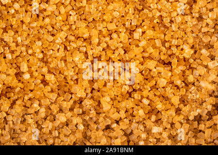 Zucchero greggio di canna sfondo marrone Foto Stock