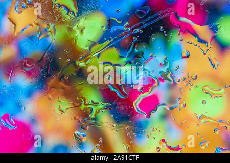 Abstract luminoso dello sfondo colorato. Macro multicolore bolle di acqua, macchie e chiazze Foto Stock