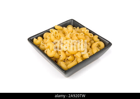 Pila di giallo essiccato di pasta tipo gramigna forme di pasta Foto Stock