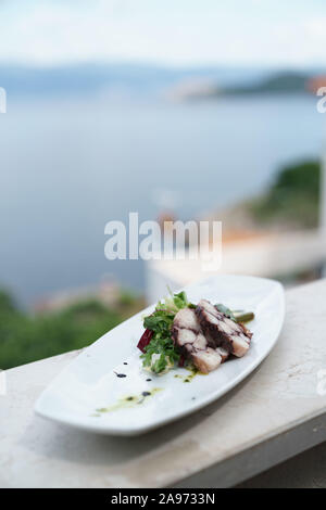 Piastra del polpo, Konoba Nada, sull'isola di Krk, Croazia Foto Stock