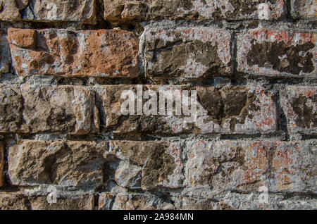 Muro di mattoni, eccellente rustico sfondo astratto o uno sfondo Colori e dettagli in questa splendida annata muro di mattoni, costruito anni fa. Foto Stock