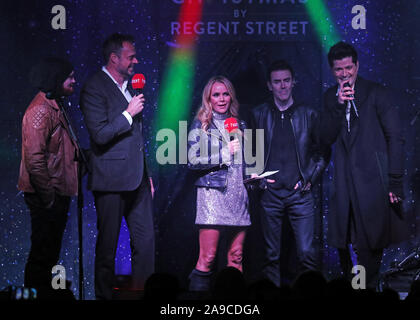 (Da sinistra a destra) Mark Sheehan dallo script, cuore presentatori radio Jamie Theakston e Amanda Holden con lo script membri Glen Power e Danny O'Donoghue durante il Regent Street le luci di Natale accendere, Londra. Foto Stock