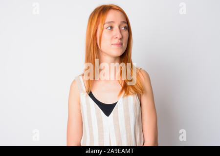 Volto del giovane bella donna redhead pensando Foto Stock