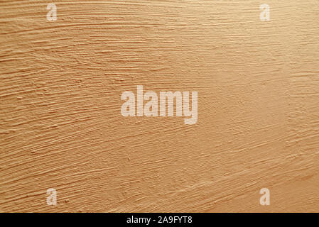 Parete in cemento dello sfondo. Muro Beige texture. Il beige o parete gialla texture. Materiale per i progettisti. Sfondo del dipinto di cemento. Putty parete ho verniciato Foto Stock