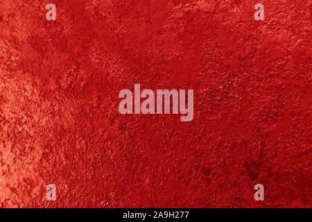 Texture di sfondo di una parete strutturata in rosso. Stilizzata tessiturali banner con spazio per il testo. Foto Stock