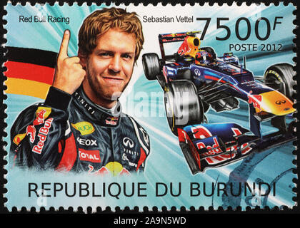 Racing driver Juan Sebastian Vettel sul francobollo Foto Stock