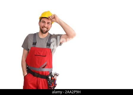 Allegro lavoratore edile - artigiano in abiti da lavoro su sfondo bianco - isolato Foto Stock