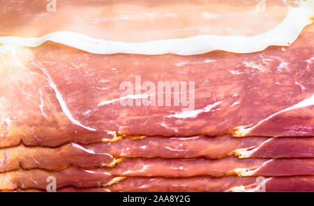 Texture di fette di prosciutto o prosciutto di Parma, sfondo Foto Stock