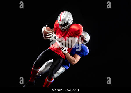 Due american football giocatori in azione Foto Stock