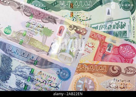 Denaro iracheno - dinar per un background aziendale Foto Stock
