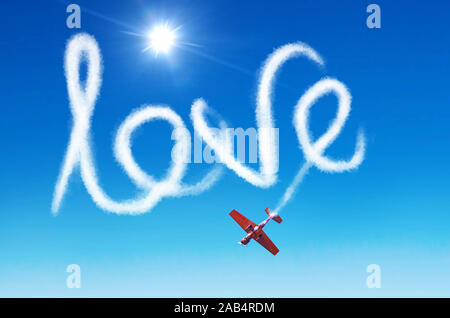 Iscrizione nel cielo - amore lasciato dal fumo bianco da un aeroplano Foto Stock