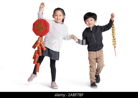 Felice i gemelli per celebrare il capodanno cinese Foto Stock