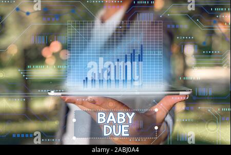 Parola di scrittura di testo Baby dovuta. Business photo vetrina circa alla nato sotto l'impegno in termini di tempo dovrebbe essere pronto Foto Stock