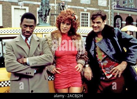 Jamie Lee Curtis, Eddie Murphy e Dan Aykroyd, sul set del film "Trading