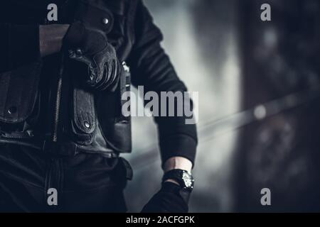 La guardia di sicurezza il concetto di lavoro foto. Gilet tattico Closeup. Foto Stock