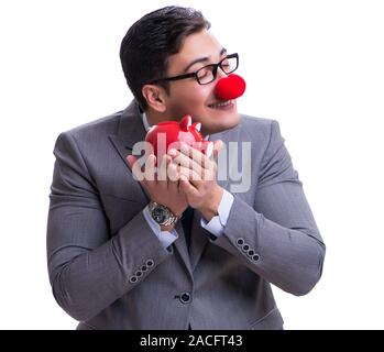 Funny clown imprenditore con un salvadanaio isolati su sfondo bianco Foto Stock