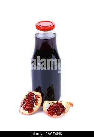 Bottiglia di succo di frutta e mature pezzo granata Foto Stock