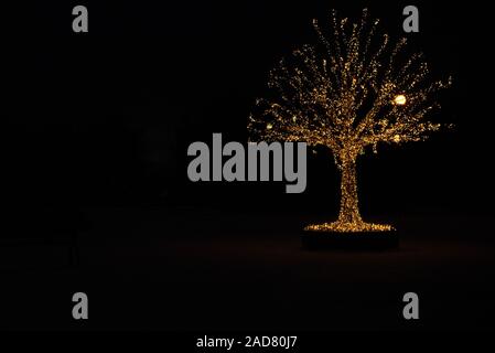 Luci oro albero di Natale Foto Stock